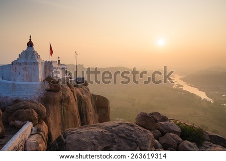 Monkey temple at sunrise hampi india  Royalty-Free Stock Photo #263619314