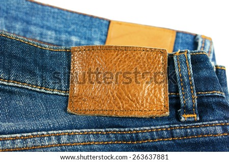 Jeans with leather label isolated on white background