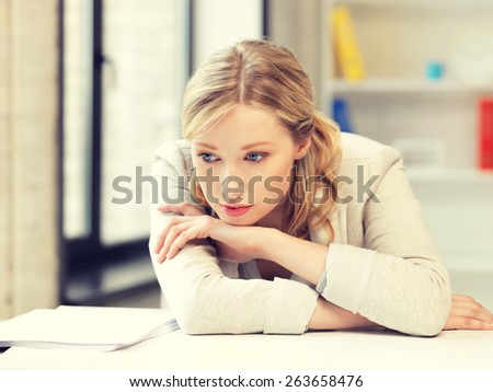 bright picture of unhappy woman in office