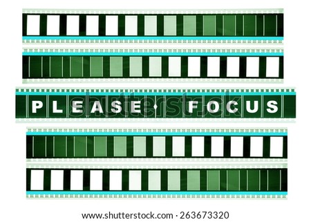 Piece of 35 mm motion film with the word 'please focus' on it