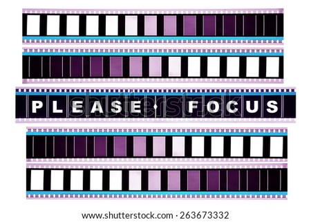 Piece of 35 mm motion film with the word 'please focus' on it