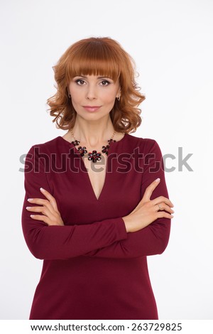 She is beautyful. Woman in dark red colored dress on white