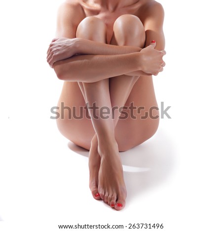 woman with beautiful legs sitting on a floor
