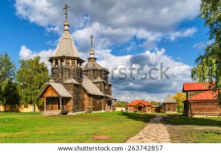 Russian church for tourists, Suzdal, Golden Ring of Russia. Traditional country view in Russia, old wooden Ortxodox temple and sky in summer. Theme of village, rustic house, life, travel in Russia. 