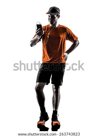 one young man runner jogger using smartphones headphones in silhouette isolated on white background