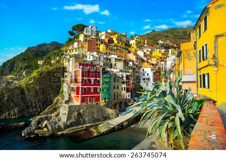 Riomaggiore village on cliff rocks and sea at sunset., Seascape in Five lands, Cinque Terre National Park, Liguria Italy Europe. Long Exposure