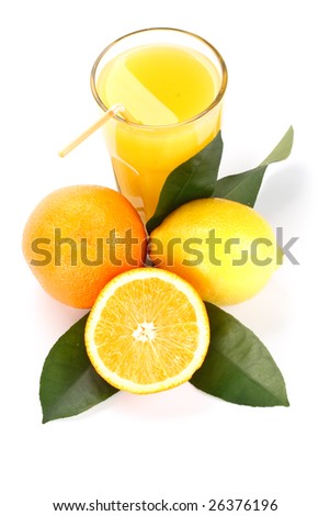 Orange and lemon with green leaves and glass of juice on a white background