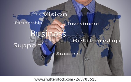 businessman writing partner concept for business with world map background(Elements of this image furnished by NASA)