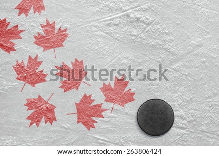 Hockey puck and a schematic representation of the Canadian flag. Concept