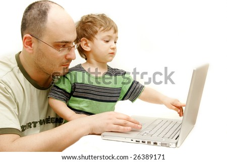 father and son with laptop over white