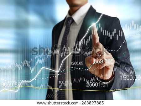 Businessman with financial symbols coming Royalty-Free Stock Photo #263897885