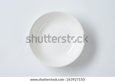 empty white bowl on white background Royalty-Free Stock Photo #263927150