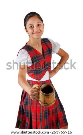 Teenager dressed with red plaid clothing and mug of beer on white background.