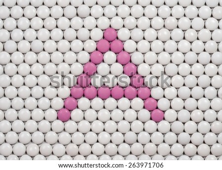 Vitamin A made of tablets on background of pills