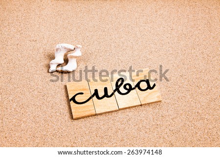 The word Cuba formed from small pieces of wood containing a sun and beach tourist destination