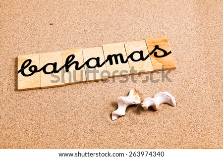 Words formed from small pieces of wood containing a sun and beach tourist destination,  Bahamas