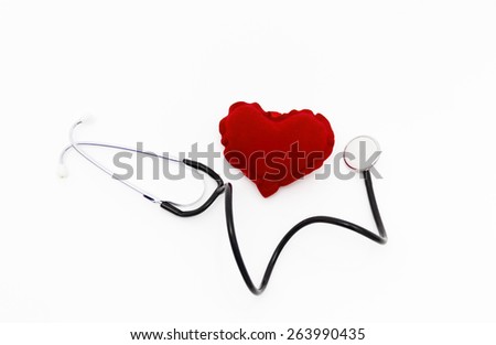 Doctor's stethoscope listening to a healthy red heart, health concept, taking care about health