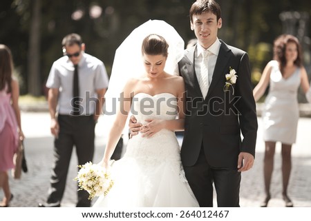 Wedding couple walking in the park