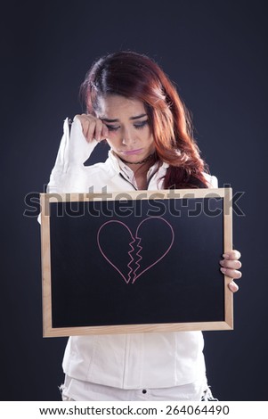 young girl with blackboard with heart