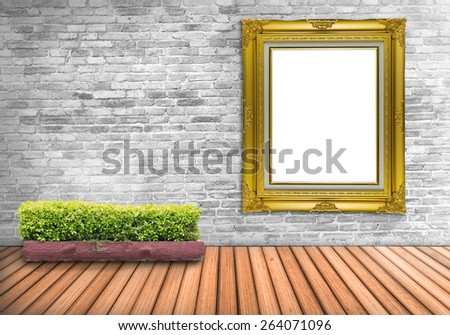 Big Blank frame vintage on a concrete wall with tree pot on wood floor : Fill photo and text