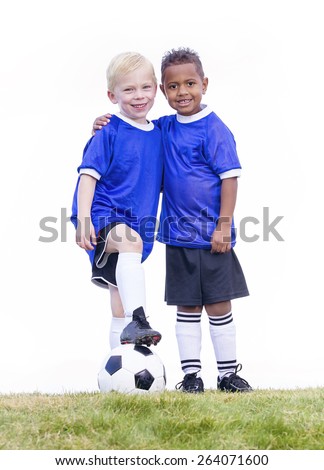 Two diverse young soccer players on white background. Full length view of two youth recreation league soccer players.