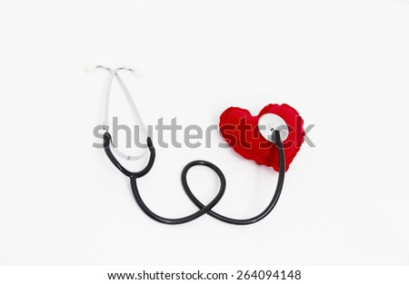 Doctor's stethoscope listening to a healthy red heart, health concept, taking care about health