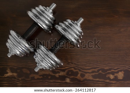 dumbbells on wooden table