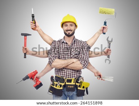 Handyman with tools Royalty-Free Stock Photo #264151898