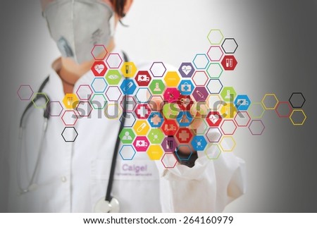 Doctor standing and pressing modern medical type of button