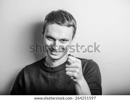 Closeup portrait unhappy young man giving thumb, finger fig gesture you are going to get zero nothing. Negative emotions, facial expressions, feelings, body language, signs