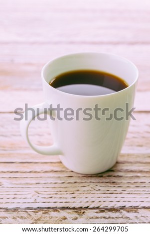 Coffee cup on wooden table - Vintage effect style pictures