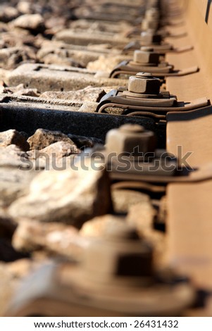 Rusty aligned screws of railway train