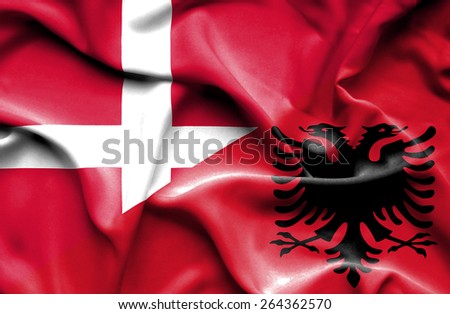 Waving flag of Albania and Denmark