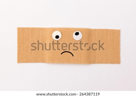 Get well soon - Band-aid with comic face expression looking sick or feeling bad