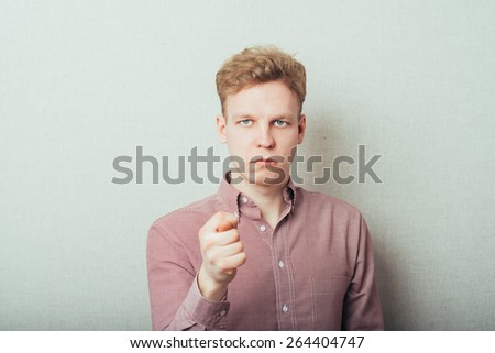 Closeup portrait happy young man giving thumb, finger fig gesture you are going to get zero nothing. Pozitive emotions, facial expressions, feelings, body language, signs