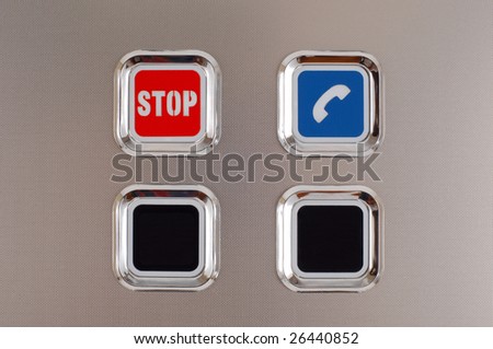 red stop button on the metal surface
