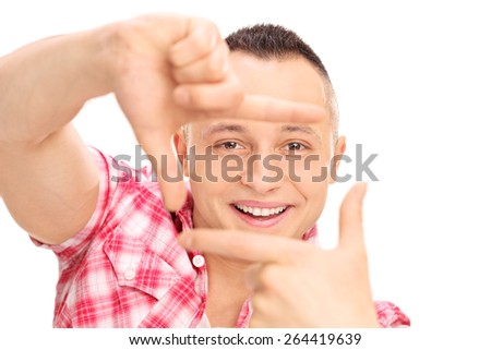 Close-up on a young Caucasian guy framing a photo with his fingers isolated on white background