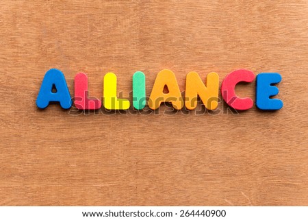 alliance colorful word on the wooden background