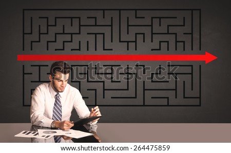 Successful businessman with a solved puzzle in background
