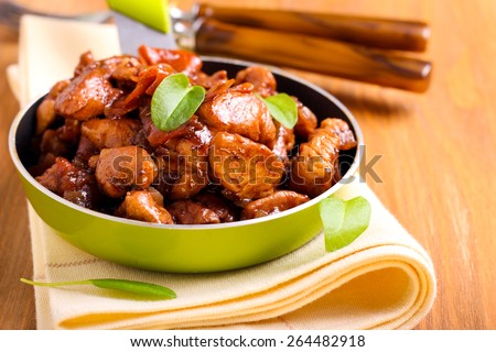 Chicken breast bits in soy sauce casserole Royalty-Free Stock Photo #264482918