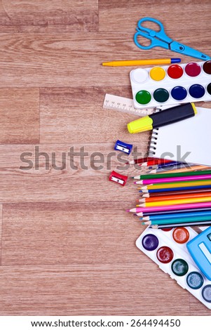 School supplies on a wooden background
