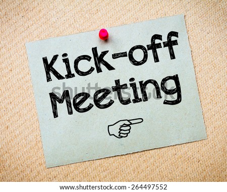 Kick-off meeting Message. Recycled paper note pinned on cork board. Concept Image Royalty-Free Stock Photo #264497552