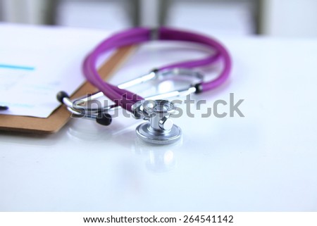 Doctor's stethoscope  with folder on the desk