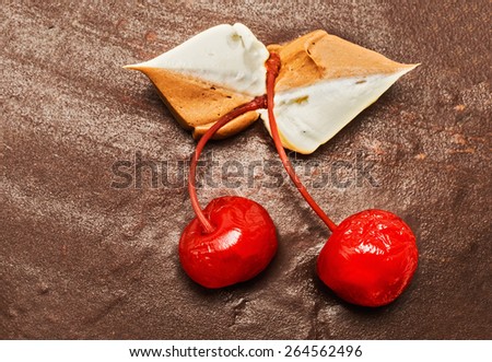 Cherry on a background of of chocolate