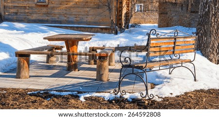  cozy rustic patio with table and bench