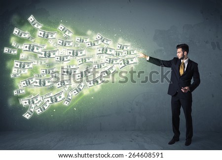 Business person throwing a lot of dollar bills concept on background