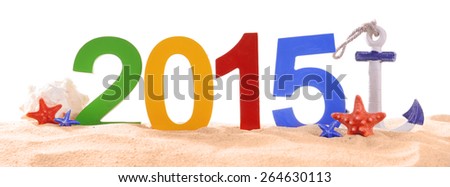 2015 sign on beach sand