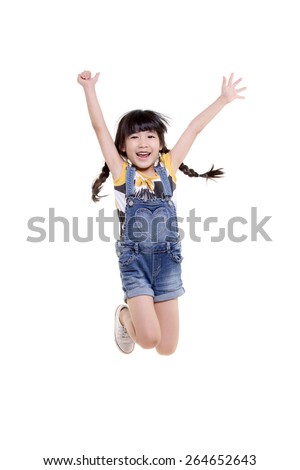 Portrait of happy little Asian child jumping isolated on white  Royalty-Free Stock Photo #264652643