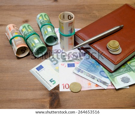 Euro Money, pen and notebook on the table