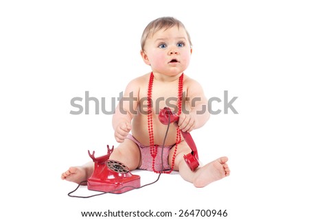 Cute caucasian baby playing with telephone isolated on a white background